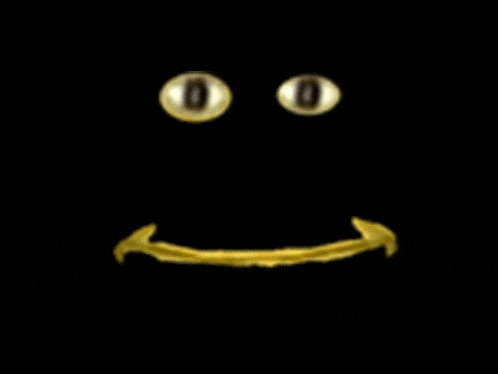 a black background with a gold smiley face with glowing eyes