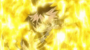 a person is standing in front of a yellow background with a lot of fire coming out of it .