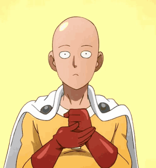 a bald man in a yellow cape says ah