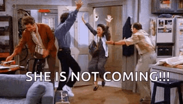 a group of people are jumping in the air in a living room while a woman says `` she is not coming '' .