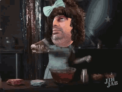 a cartoon of a man in a dress with a bow on his head and jib jab written on the bottom