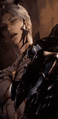 a man with horns on his head is wearing a black armor .