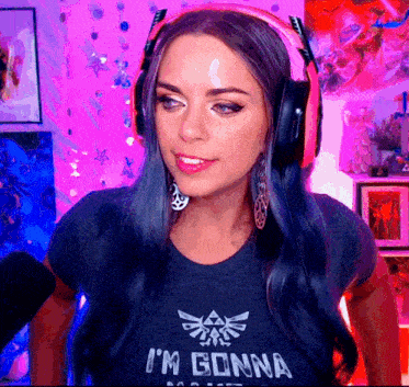 a girl wearing headphones and a shirt that says i 'm gonna
