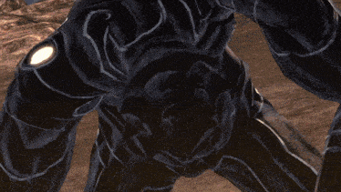 a close up of a black object with a yellow light coming out of its mouth