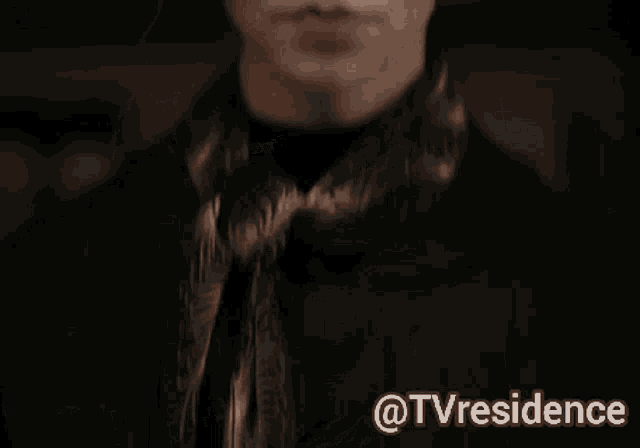 a close up of a woman wearing sunglasses with the words tvresidence below her