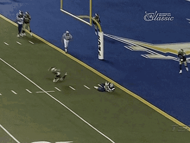 a football player is laying on the field with the number 92 on his jersey