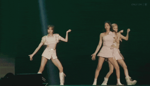 two women are dancing on a stage and the words only on are visible