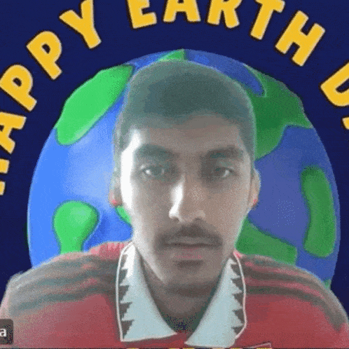 a man with a mustache is looking at the camera in front of a globe .