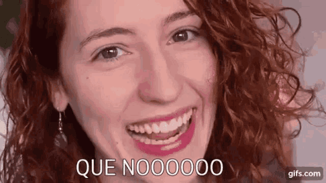 a close up of a woman 's face with the words que noooooo written below her