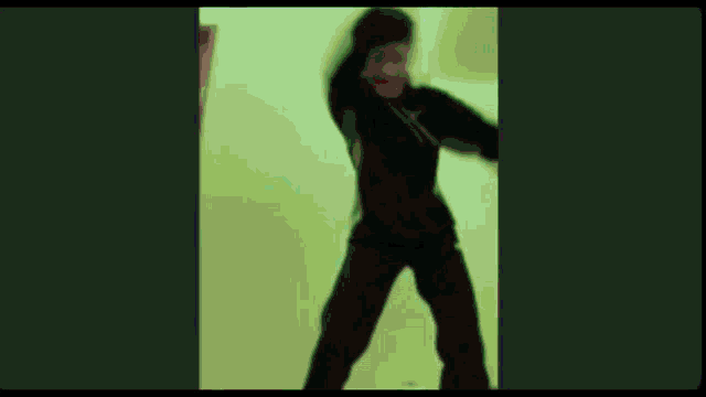 a green screen with a shadow of a person on it .