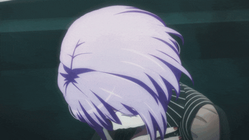 a close up of a person with purple hair and a black shirt
