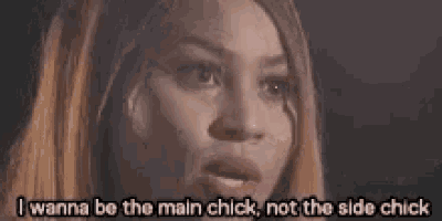 a close up of a woman 's face with the words `` i wanna be the main chick , not the side chick ''