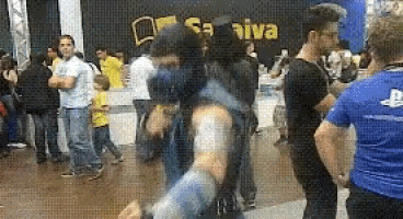 a group of people are standing in front of a sign that says sa iva