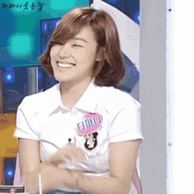 a woman wearing a name tag that says emilia smiles