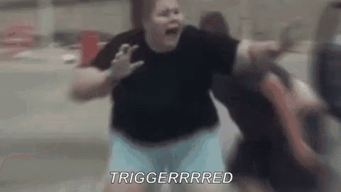 a woman is screaming and fighting another woman in a parking lot .
