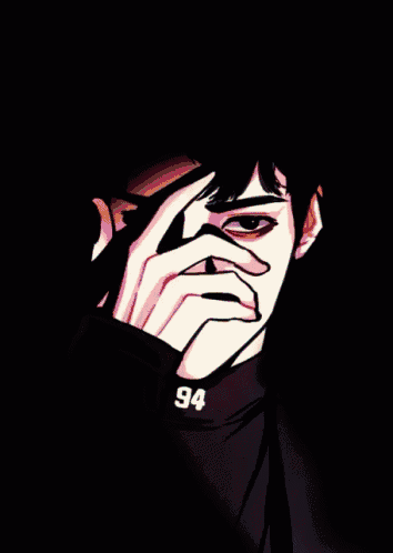 a person covering their face with their hands and a necklace that says nb
