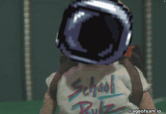 a person wearing a shirt that says school rule giving the middle finger