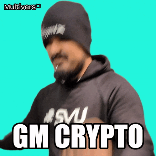 a man wearing a beanie and a hoodie says " gm crypto "