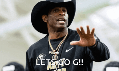 a man wearing a cowboy hat and a shirt that says let 's go g !!