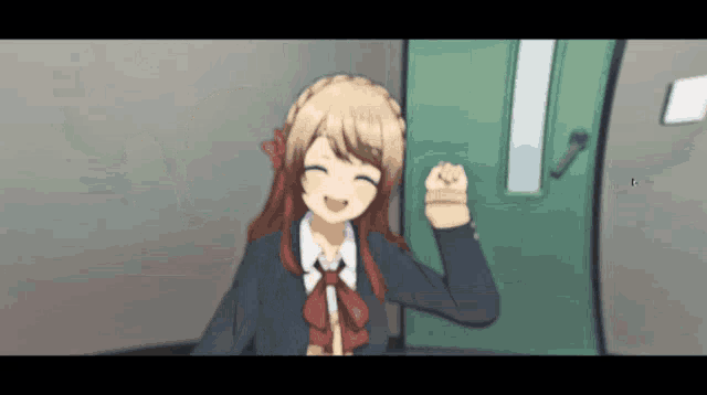 a girl in a school uniform stands in front of a green door with her fist in the air