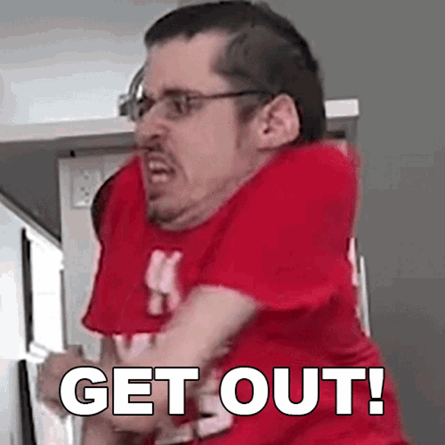 a man in a red shirt with the word get out on it