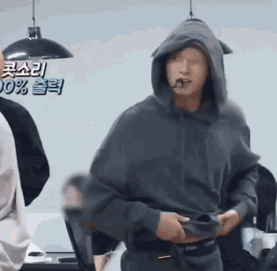 a man wearing a hooded sweatshirt with ears on it