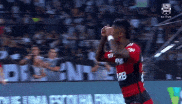 a soccer player is celebrating a goal during a soccer match .