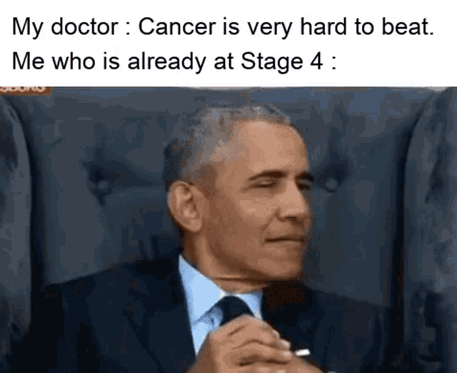 a man in a suit and tie is sitting in a chair with his eyes closed and a caption .