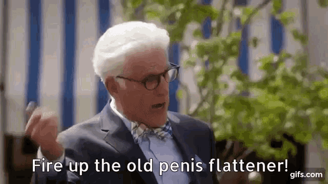 a man in a suit and bow tie is talking and saying `` fire up the old penis flattener '' .