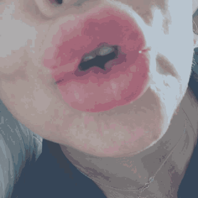 a close up of a woman 's mouth and lips