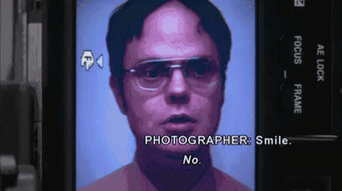 a close up of a man 's face with the words " photographer smile " on the bottom