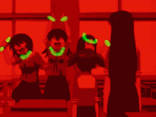 a group of girls are standing in a classroom with their hands in the air .