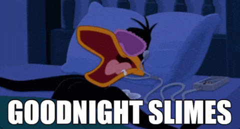 a cartoon of a duck laying on a bed with the words goodnight slimes below it