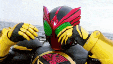 a man in a superhero costume with a helmet and gloves