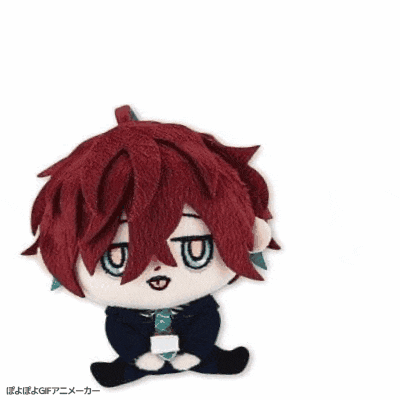 a stuffed toy of a boy with red hair and a tie
