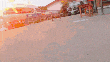 a person is standing on a concrete surface with a fireball coming out of their foot .