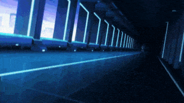 a very long hallway with blue lights on the walls and floor