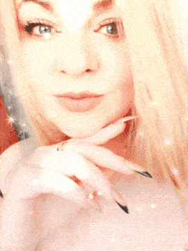 a woman wearing a white shirt with a cut out on the chest
