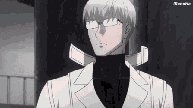 a man wearing glasses and a white coat is standing in front of a wall .