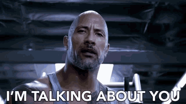 a bald man with a beard is talking about you .