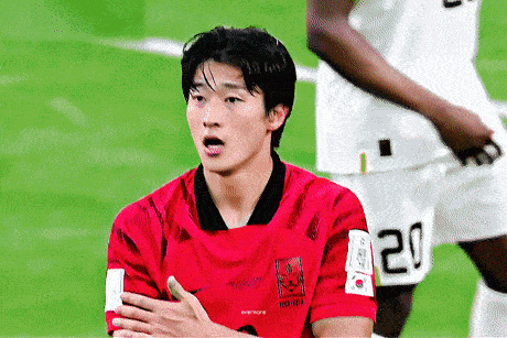 a soccer player wearing a red shirt with the number 20 on it