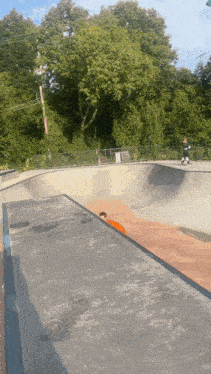 a person riding a skateboard in a skate park