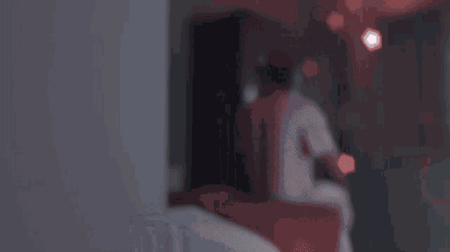 a blurry picture of a person standing in a room