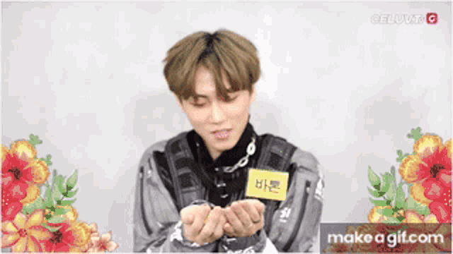 a young man with a name tag that says ' bae ' on it