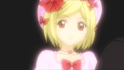 a girl with blonde hair and a pink dress has a red bow on her head