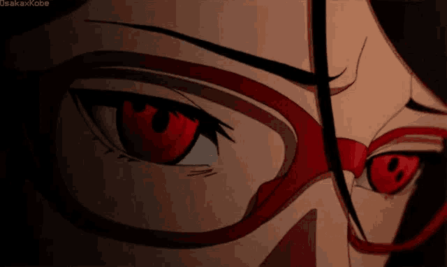 a close up of a person 's eyes with red eyes .