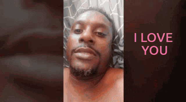 a man with a beard says i love you in pink