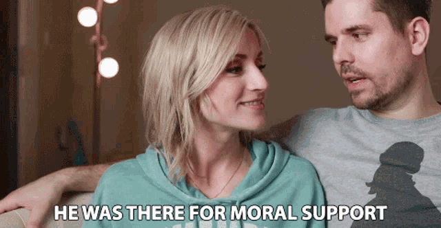 a man and a woman are looking at each other with the words he was there for moral support below them
