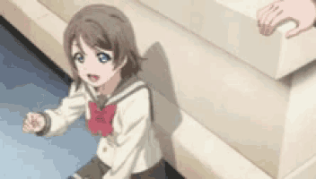 a girl in a school uniform is sitting on a set of stairs next to a wall .