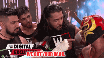 a man in a wrestling mask is pointing at another man with the words digital exclusive we got your back